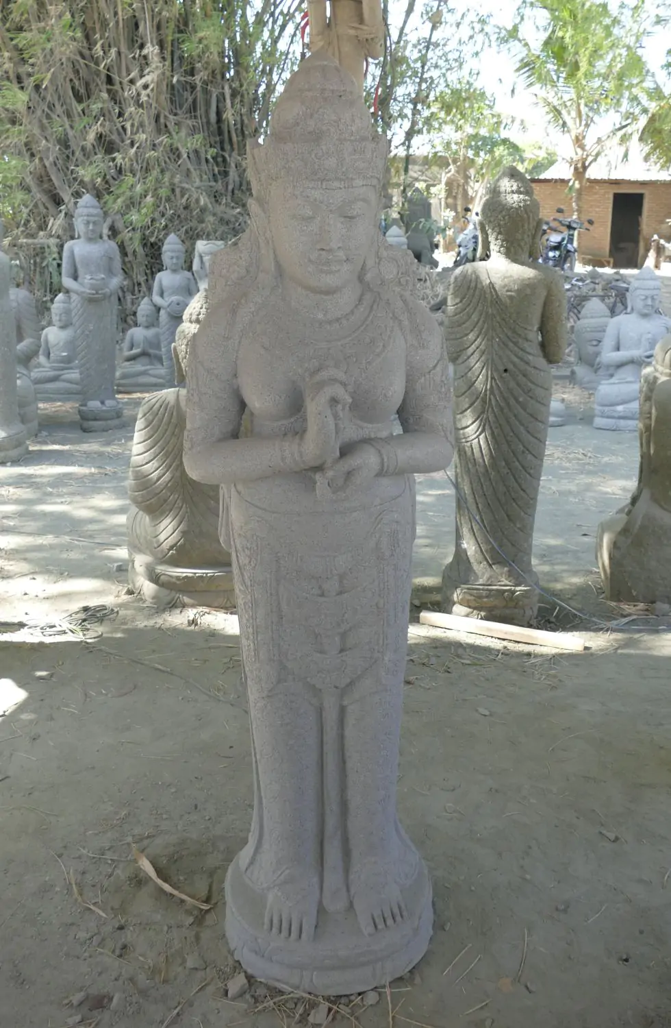  Product image 1 of the product “Standing Dewi Sri, position greetings turning the wheel ,160cm high riverstone grey ”
